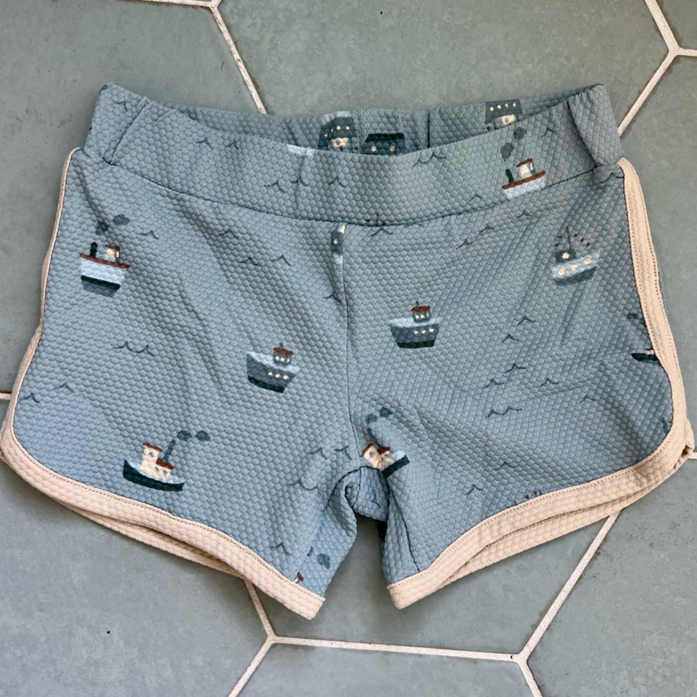 Toddler boys blue boats swim shorts.